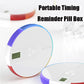 Portable pill timing reminder box with rainbow edge and LCD screen on white base