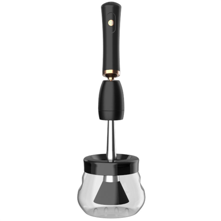 Electric makeup brush cleaner with black handle and clear cleaning cup base