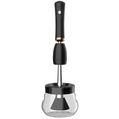 Electric makeup brush cleaner with black handle and clear cleaning cup base