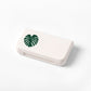 White portable medicine box with 3 compartments and green leaf graphic on lid