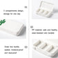 White portable medicine box with lid open showing three interior compartments