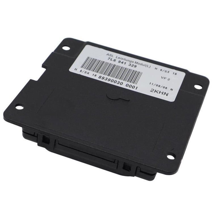 AFS headlight turning control module, black housing with barcode label and mounting tabs