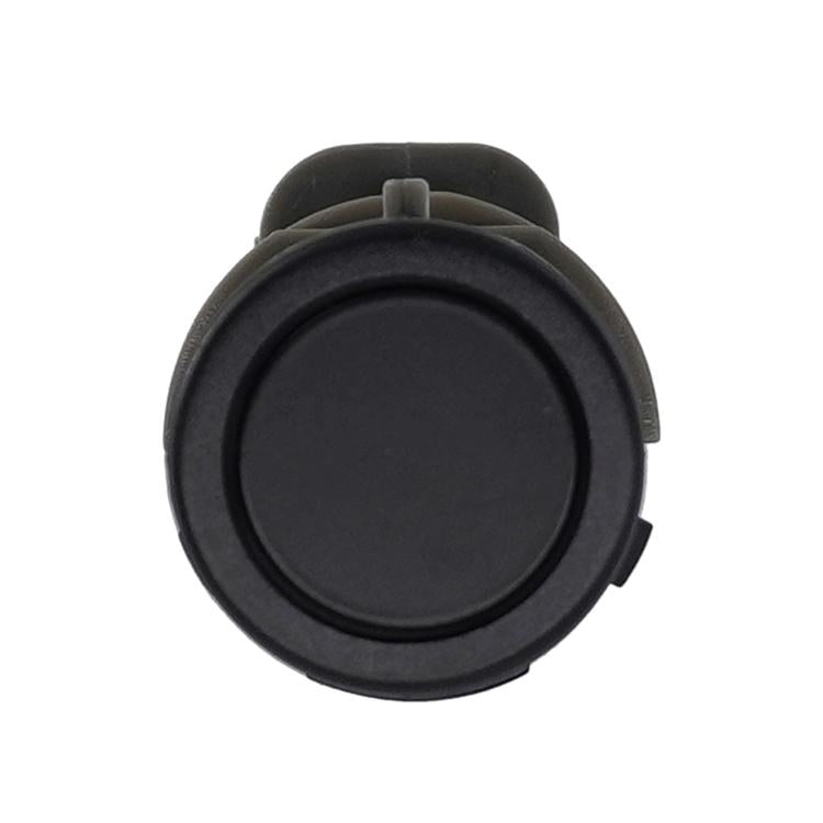 Round black car reversing radar sensor with flat outer bezel and raised rim