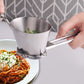 Stainless steel coriander chopper dispensing chopped herbs onto a plate