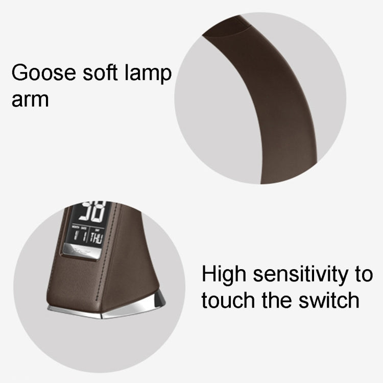 Black LED desk lamp with arched arm and vertical digital display on the base