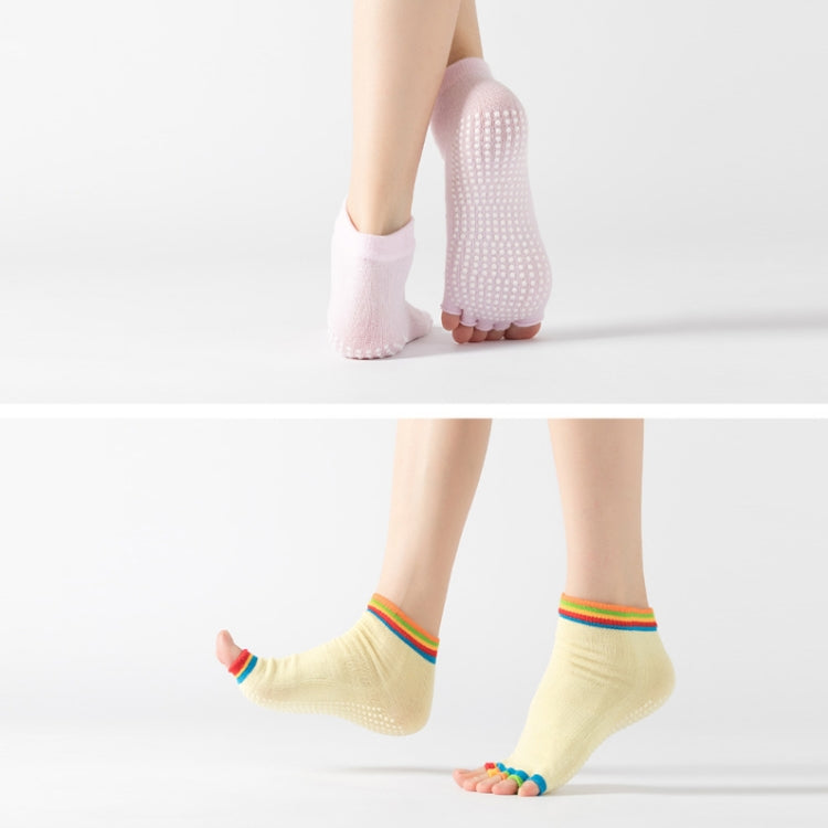 Light pink and light yellow open-toe five-finger yoga socks with dotted soles and rainbow cuffs