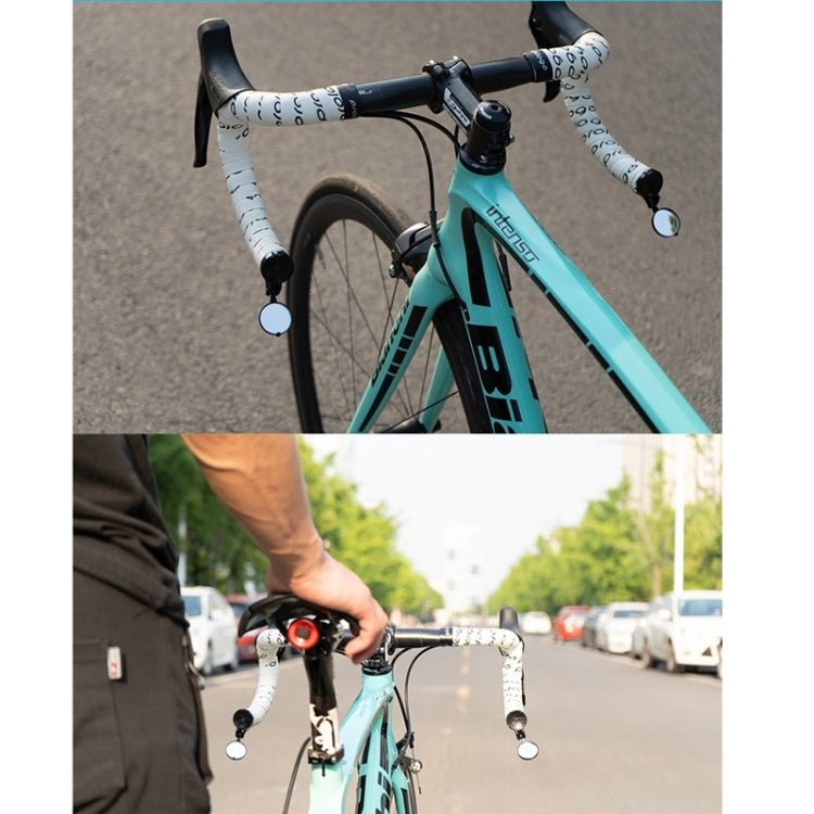 Bicycle handlebar mirror and plug reflector mounted on road bike