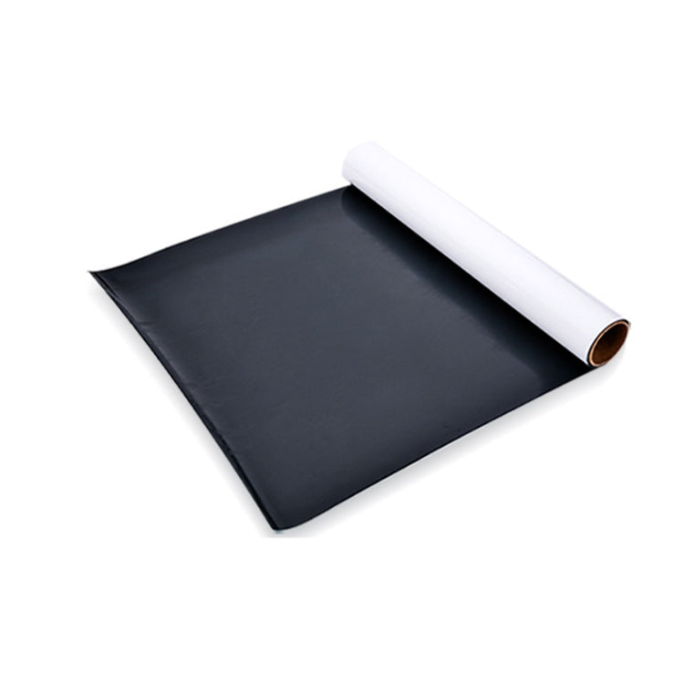 Magnetic whiteboard sticker sheet laid flat, with rolled white edge and dark backing