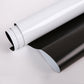 Close-up of rolled magnetic whiteboard sticker, white top layer and dark underside
