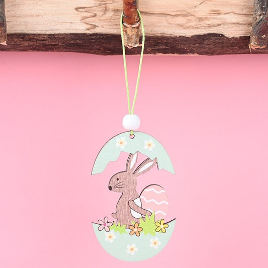 Easter wooden egg pendant with bunny lifting a white egg and flower accents