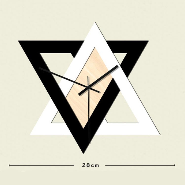Geometric wall clock with star frame, light wood center, black hands; 28 cm length