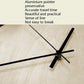 Wall clock hands with black aluminum-style pointers and central hub on pale wood dial