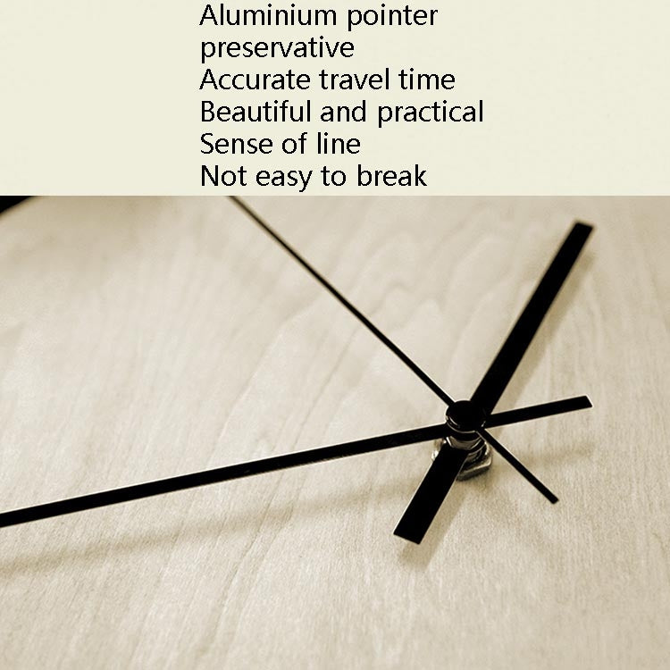 Wall clock hands with black aluminum-style pointers and central hub on pale wood dial