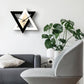 Star-shaped geometric wall clock with black and white frame, light wood center, black hands