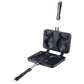 Black fish waffle maker open, showing two fish molds on plates and handle
