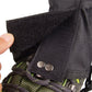 Black foot cover fabric close-up with metal snap and adjustable strap