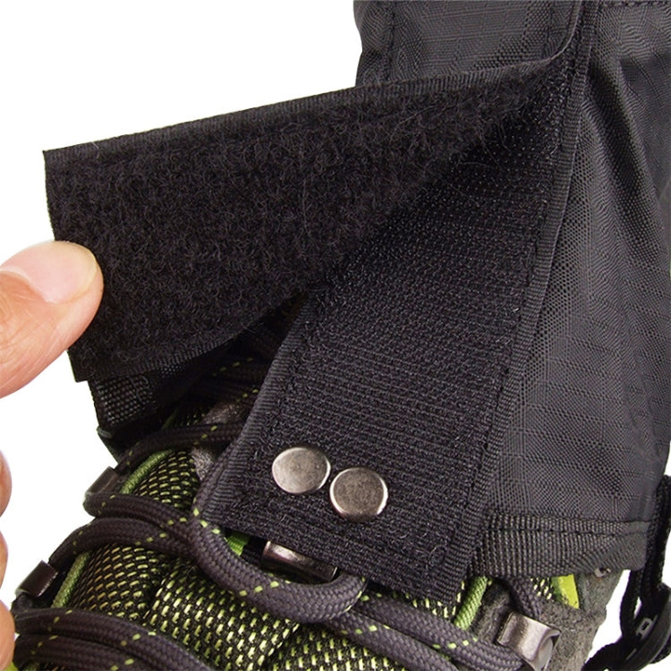 Black foot cover fabric close-up with metal snap and adjustable strap