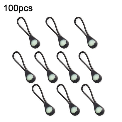 Set of luminous backpack zipper pulls, black cords with light green oval heads