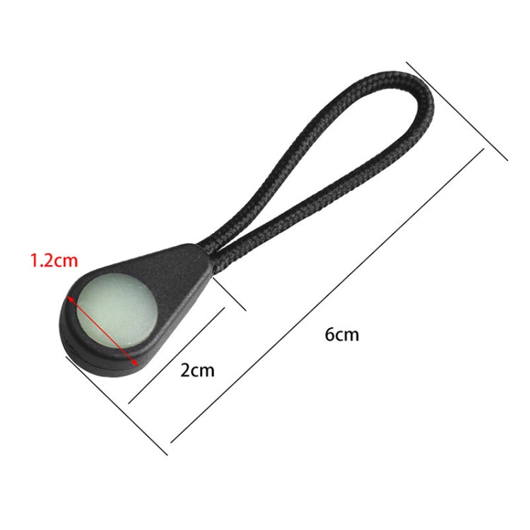 Single luminous zipper pull with black cord and light green oval cap, 6 cm length