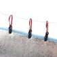 Tarp canopy clips on rope line, red carabiners with black clamps