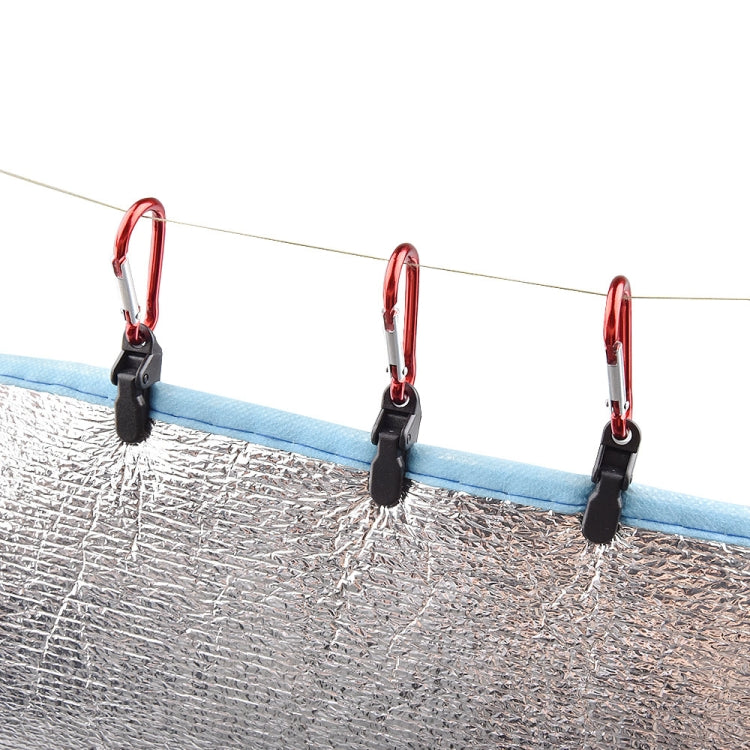 Tarp canopy clips on rope line, red carabiners with black clamps