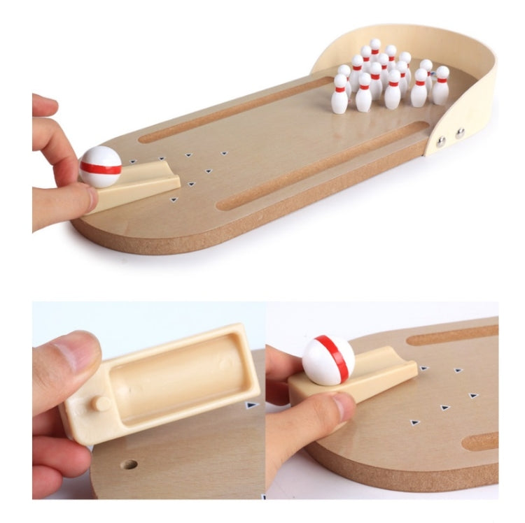 Desktop wooden bowling puzzle toy with pin lane, ball lever, and close-up inserts