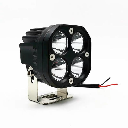 Quad-LED motorcycle spotlight with black housing, metal mount bracket, and power wires