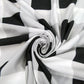 Black-and-white striped stroller cover fabric close-up with folded layers