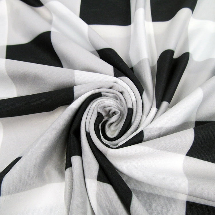 Black-and-white striped stroller cover fabric close-up with folded layers