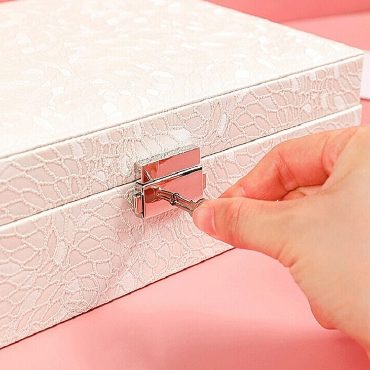 White jewelry box with decorative clasp lock on the front lid