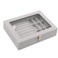 Gray flannel jewelry storage box with hinged lid and divided grid compartments, open view