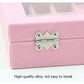 Close-up of metal hinge latch on pink flannel jewelry storage box
