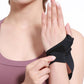 Black wrist support with thumb cover, fitted snugly on the wrist.