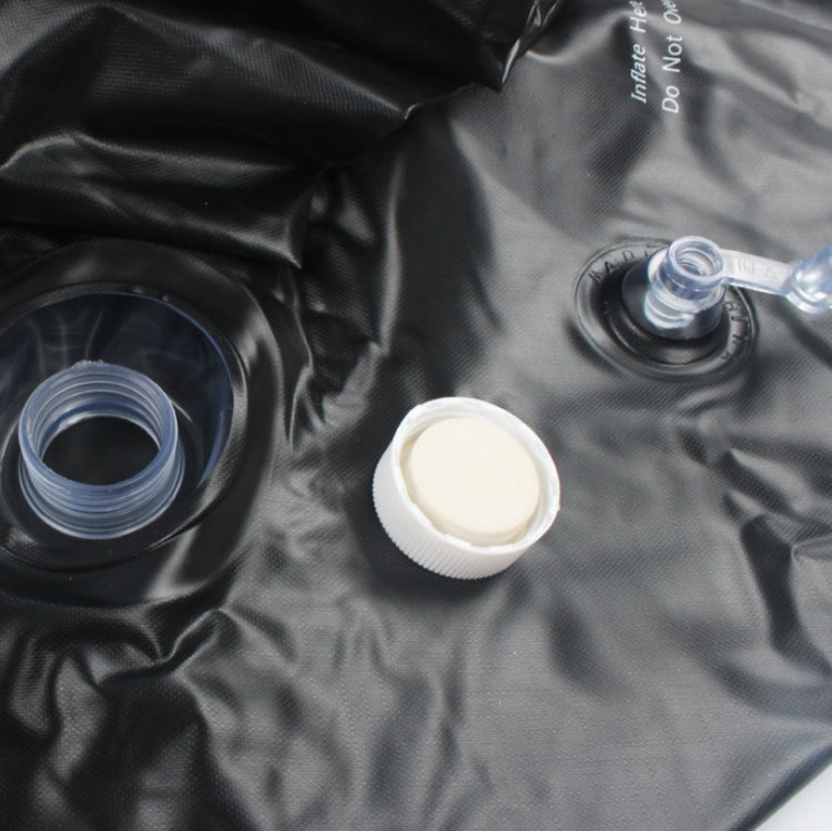 Inflatable punching bag accessories: black air valve parts and a white screw cap.