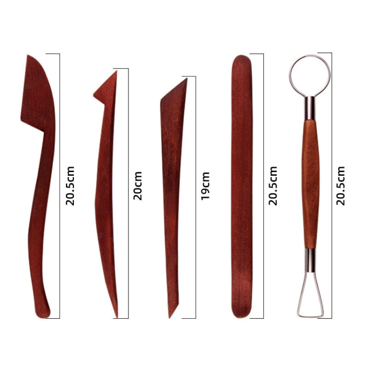 Assorted pottery clay carving tools with dark red wooden handles and a wire loop tool