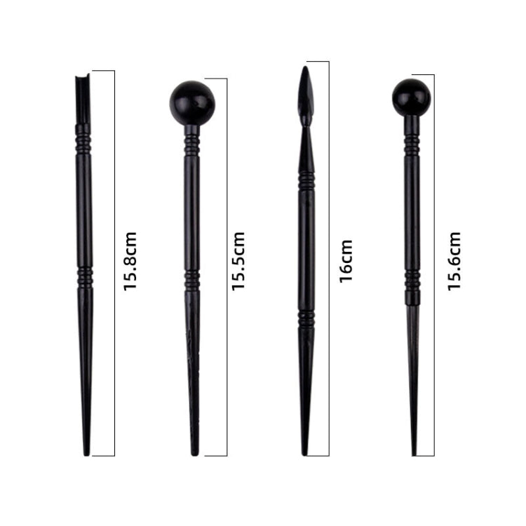 Set of black pottery clay tools with pointed tips and a round ball-ended tool
