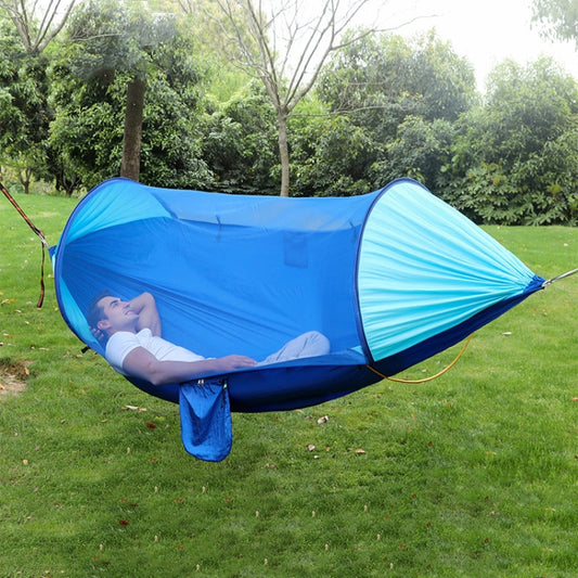 Blue double camping hammock with mosquito net canopy