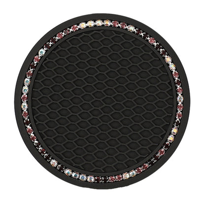 Black circular car cup coaster mat with honeycomb texture and rhinestone-trim border.