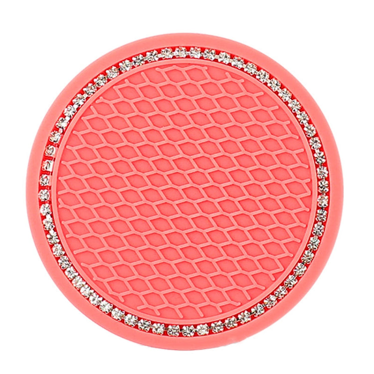 Red/pink circular car cup coaster mat with honeycomb pattern and rhinestone-trim border.