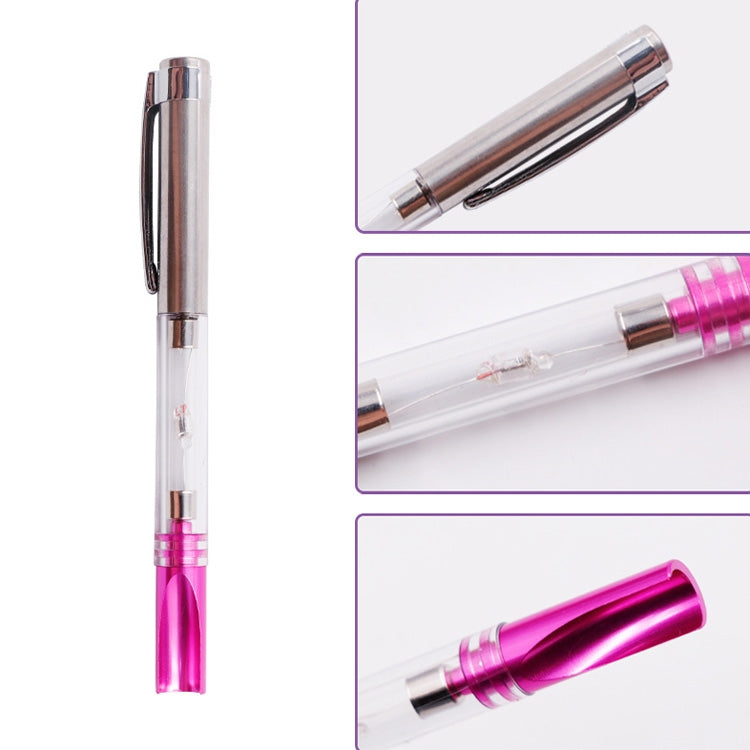 Spark test pen with clear body, chrome head, and pink contact section