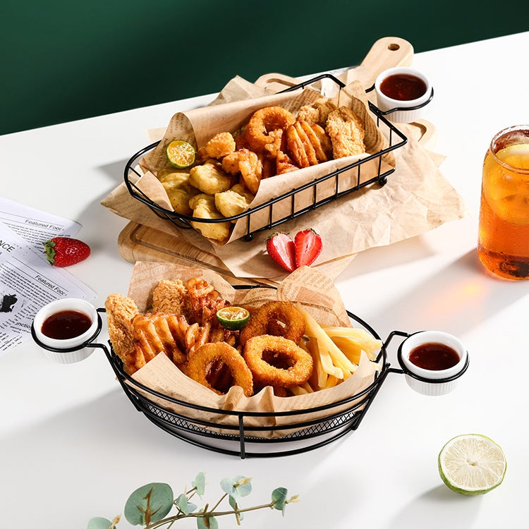 Black wire snack baskets with handles, two baskets filled with assorted fried foods