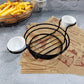 Wrought iron round wire basket with two white condiment cups