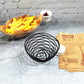 Wrought iron round spiral wire snack basket with white condiment cup