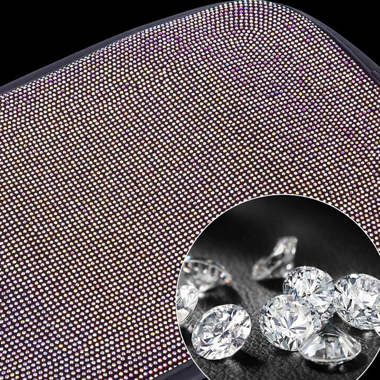 Car armrest box cushion close-up: pink and purple rhinestone diamond surface