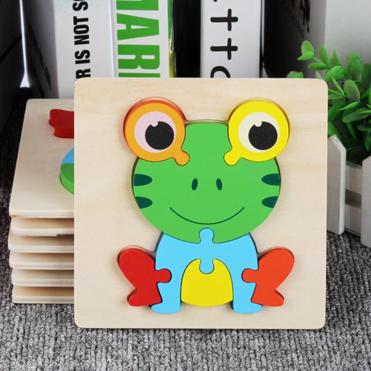 Wooden animal jigsaw puzzle with green frog face and multicolor body pieces