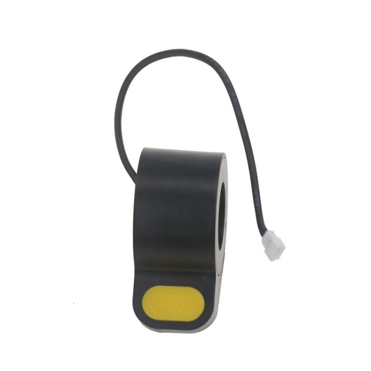 Black thumb throttle housing with yellow pad and white wiring connector