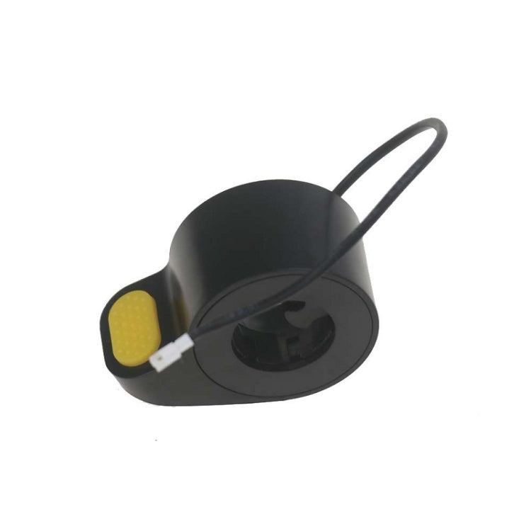 Black thumb throttle accelerator with yellow button and attached cable