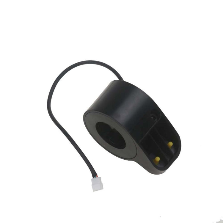 Black thumb throttle module with yellow indicator and cable with white connector