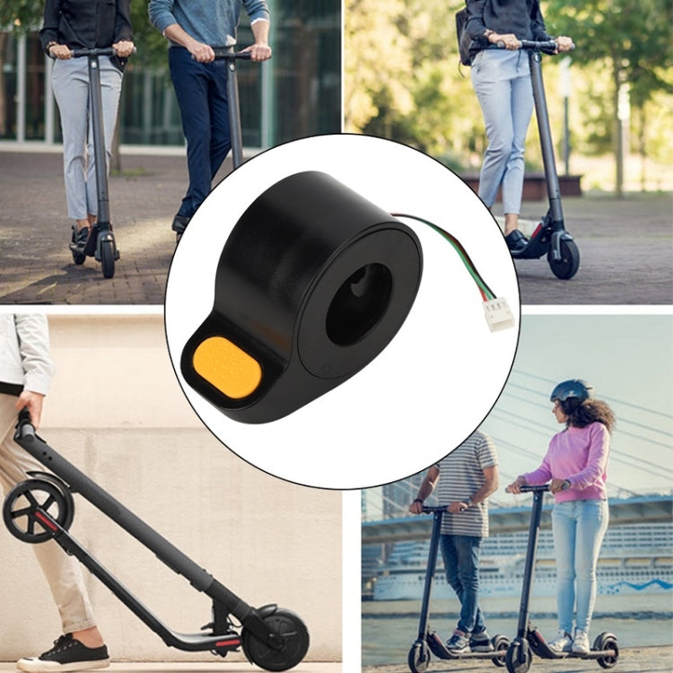 Black thumb throttle accelerator with yellow button on compact circular housing
