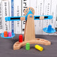 Wooden balance scale toy with blue base, colored cylinders, and hanging plate weights